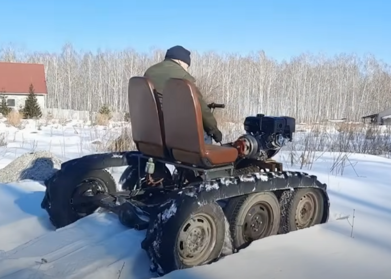 Homemade tracked all-terrain vehicle made from trash - snow is not a hindrance