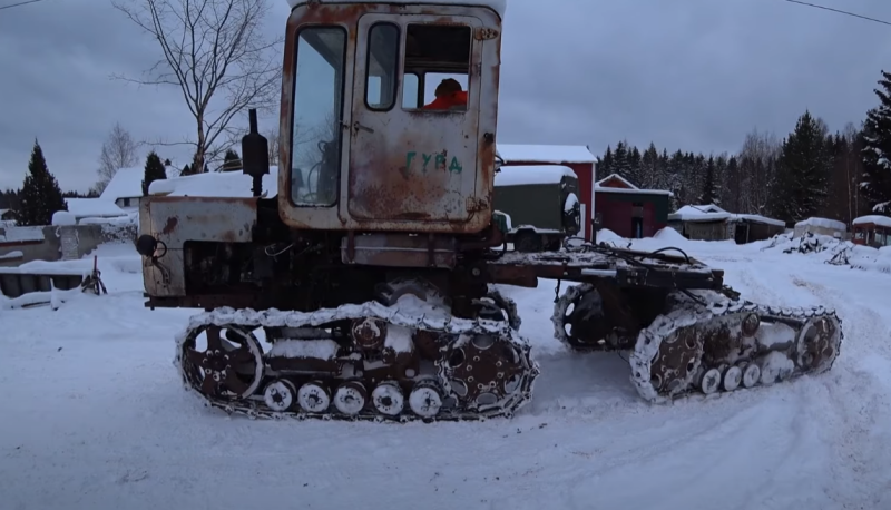 An all-terrain vehicle made from a pair of Soviet tractors pleases in motion