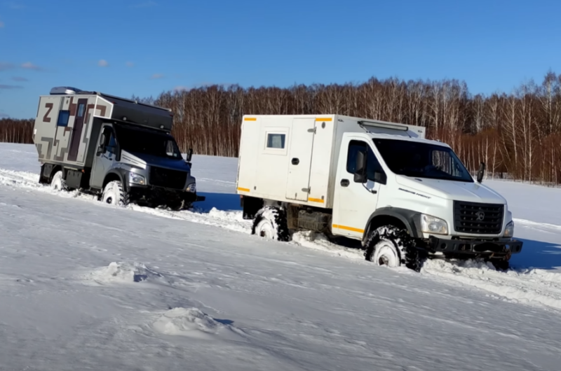 All-wheel drive GAZ and Ural trucks on virgin snow - test of chains on wheels